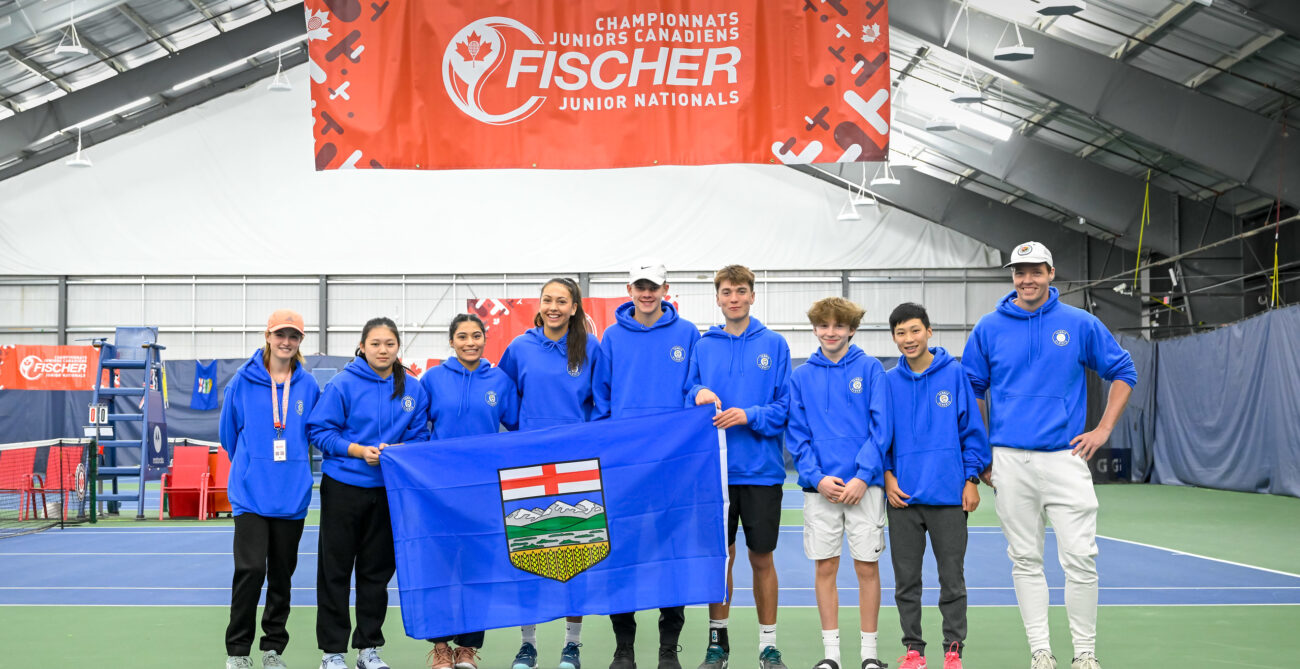 Team Alberta U18 team photograph with Alberta flag.